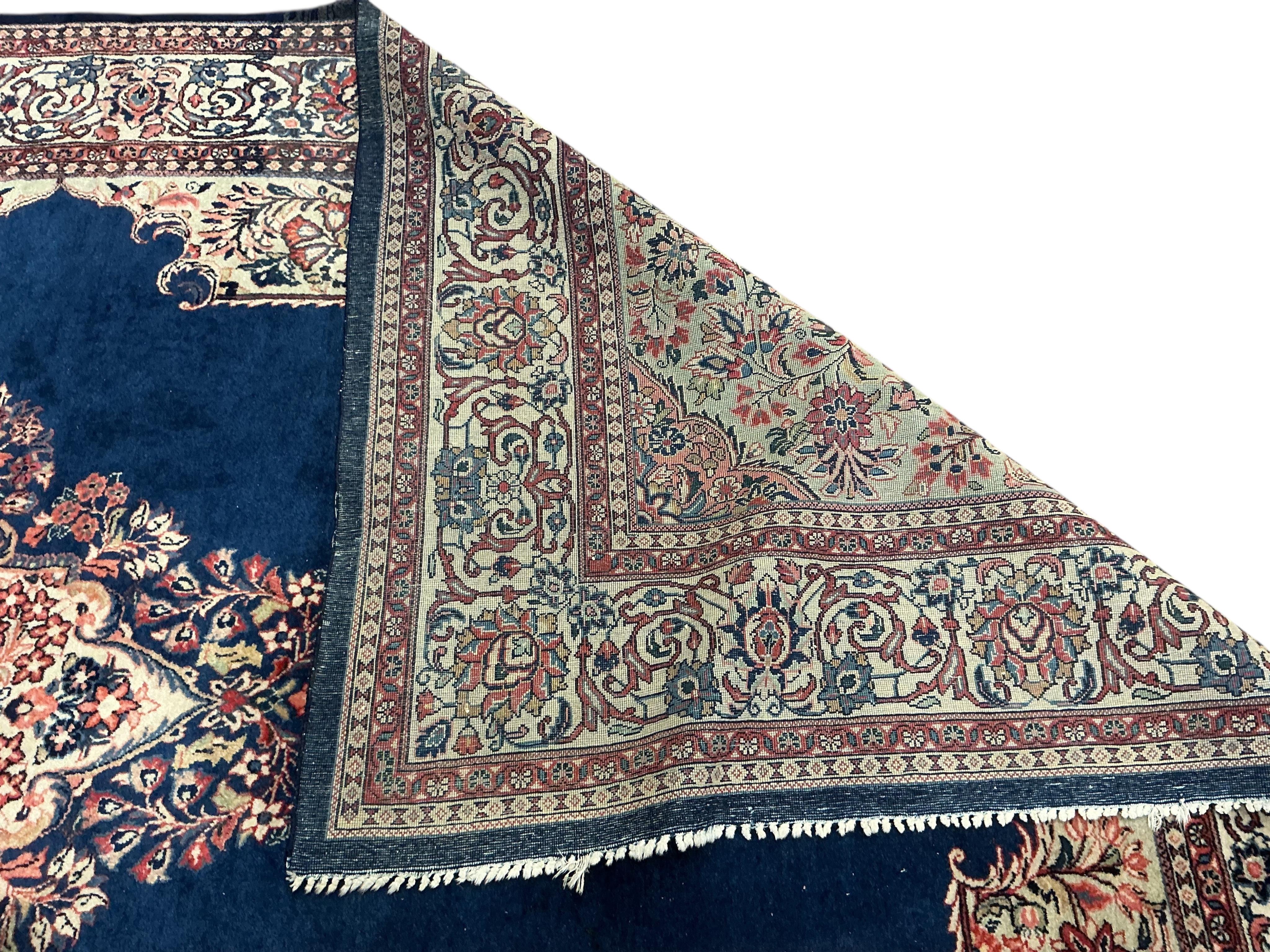 A Sarouk blue ground carpet, 320 x 210cm